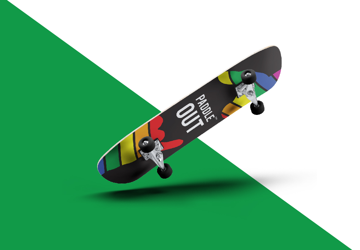 Paddle Out lifestyle branding applied to a skateboard, highlighting the connection between surf and skate culture on a green background.