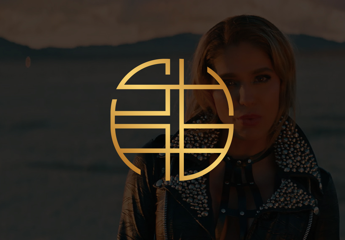Golden SHAB logo, featuring geometric interconnected lines, displayed over a brighter portrait of Iranian pop artist Shabnam (SHAB) with a subtle background.